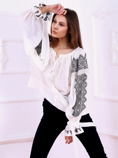 https://cdn.shopify.com/s/files/1/0119/0903/8176/files/Royal_Blouse-Black-golden_Thread_Embroidery-White-Colored_Fabric-FLORII.mp4?v=1592122306